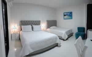 Hotel Colonial Andino - Parque principal de Pitalito客房内的一张或多张床位
