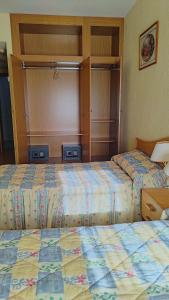 Postel nebo postele na pokoji v ubytování Hotel Ria de Vigo "Tierra de Campos"