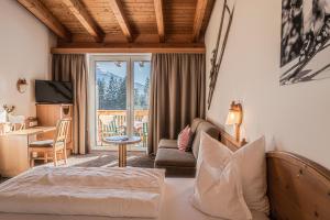 Postel nebo postele na pokoji v ubytování Sweet Cherry - Boutique & Guesthouse Tyrol