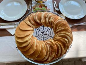 a long loaf of bread on a plate on a table at B&B Fellini Gallipoli in Gallipoli