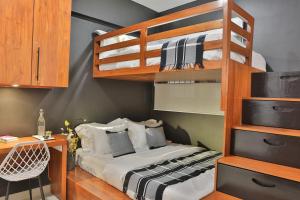 a bedroom with a bunk bed and a desk at 007 Colombo in Colombo
