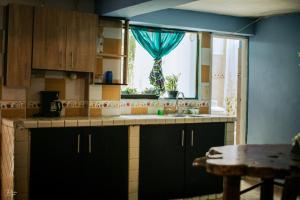 Acogedor apartaestudio tesisinde mutfak veya mini mutfak