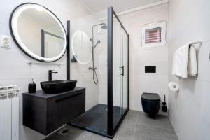 a bathroom with a black sink and a mirror at Villa M&M - ZF Hvar in Hvar +37 photos
