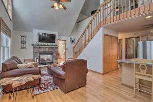 a living room with a couch and a fireplace at Deck, Pool, Trails Access Pocono Family Home! in Albrightsville