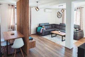 a living room with a couch and a table at House For Rest VIN in Kolašin