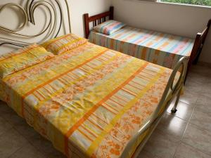 A bed or beds in a room at Casa de hospedagem providências