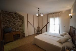 Postel nebo postele na pokoji v ubytování Hotel Casa Beletri
