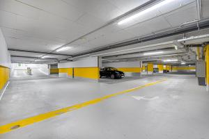 a car is parked in a parking garage at Vonder Munich in Munich