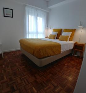 A bed or beds in a room at Tagus Life Areeiro