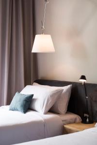 A bed or beds in a room at Five Hotel & Residences