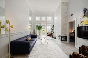 a living room with a couch and a fireplace at CLOUD NINE - Comfort & Elegance in Irvine