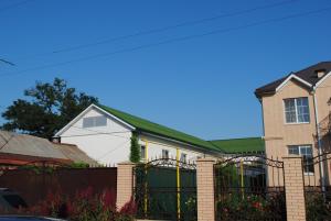 a house with a fence in front of it at Guest House Kalinina Street 133 in Yeysk