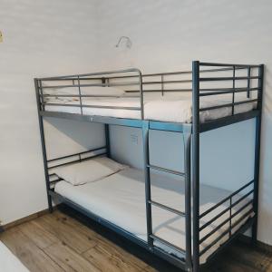a couple of bunk beds in a room at CASA VACANZE DA MARTI in Tirano +2 photos