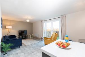 a living room with a bowl of fruit on a table at Avery House 2 - Two Bedroom with Outdoor Terrace by BPNE in Darlington
