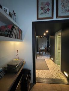 a hallway with a door leading to a dining room at Studio Dageraad in Antwerp