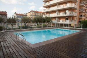 a swimming pool in front of a building at Studio With Swimming Pool 80 meters near the beach in Nice