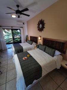 מיטה או מיטות בחדר ב-Casa Mandala Hotel