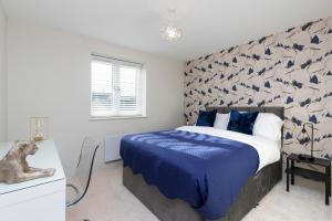 a bedroom with a bed and a wall with birds on it at Avery House 1 - One Bedroom with Outdoor Terrace in Darlington