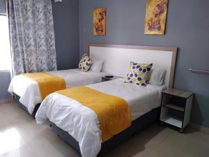 Postel nebo postele na pokoji v ubytování Legugu Bed and Breakfast + 3 fotografie