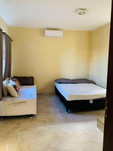 Ένα ή περισσότερα κρεβάτια σε δωμάτιο στο Casa com Piscina Armação de Búzios