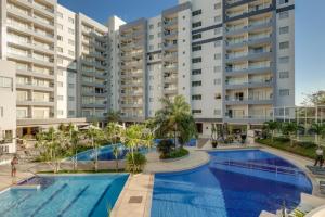 an image of an apartment complex with a swimming pool at Veredas do Rio Quente Flat 109 in Rio Quente