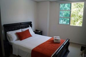 Postel nebo postele na pokoji v ubytování Hotel NelyMar