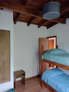 Ένα ή περισσότερα κρεβάτια σε δωμάτιο στο Cabaña Los Cipreses