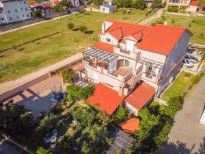 an overhead view of a house with an orange roof at Apartments Vintage in Banjol