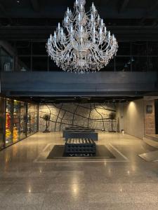 a large chandelier hanging from a ceiling in a building at White Palace Bangkok in Bangkok +133 photos