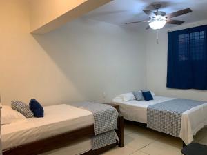 Postel nebo postele na pokoji v ubytování Posada San Jose - Tequila Centro