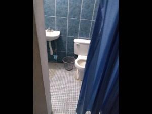 A bathroom at Room in Guest room - Lodging And Tranquility