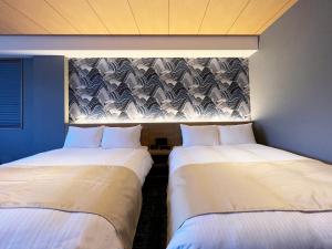 Voodi või voodid majutusasutuse Rinn Gion Shirakawa toas