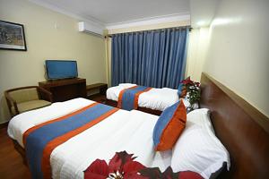 Letto o letti in una camera di Karma Hotel Nepal