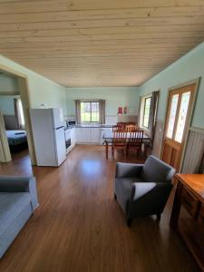 a large living room with a kitchen and a table at Mansfield Holiday Park in Mansfield
