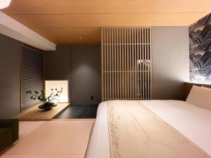 Voodi või voodid majutusasutuse Rinn Gion Shirakawa toas