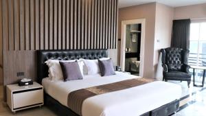 Voodi või voodid majutusasutuse KTK Pattaya Hotel & Residence toas