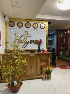 a store front with a display of flowers and plants at Holly Hostel in Da Lat