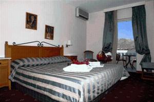 Postel nebo postele na pokoji v ubytování Crithoni's Paradise Hotel + 17 fotografií