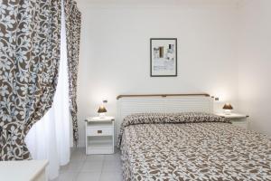 Postel nebo postele na pokoji v ubytování Hotel Valle Verde
