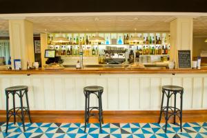 El lounge o bar de Hosteria El Capricho