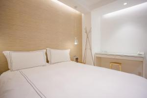 Katil atau katil-katil dalam bilik di Mini West Hotel