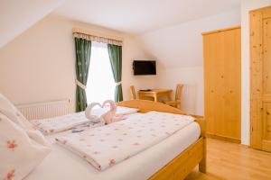 Ένα ή περισσότερα κρεβάτια σε δωμάτιο στο Gästezimmer Steiner