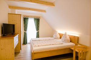 Ένα ή περισσότερα κρεβάτια σε δωμάτιο στο Gästezimmer Steiner