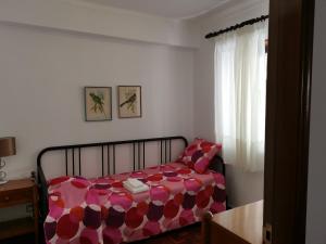 Katil atau katil-katil dalam bilik di Apartamento Gonçalves