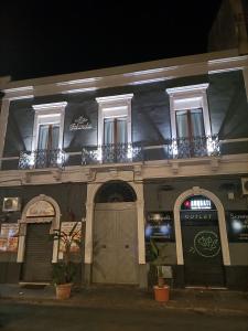 a building with two balconies on top of it at Luxury B&B Iolanda in Catania