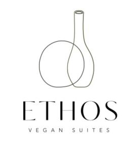 a wine bottle logo with a wine glass at Ethos Vegan Suites in Fira