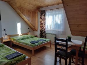 Postel nebo postele na pokoji v ubytování Jurajska Chata