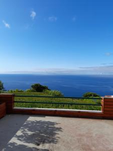 a view of the ocean from the balcony of a house at Casa da Lomba do Cavaleiro in Povoação