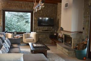 A seating area at Pefkofyto Mountain Retreat