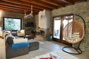 A seating area at Pefkofyto Mountain Retreat